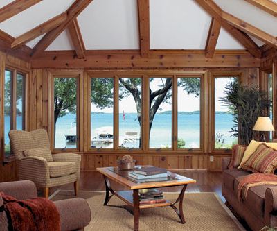 home interior living room casement windows showing lake shore outside